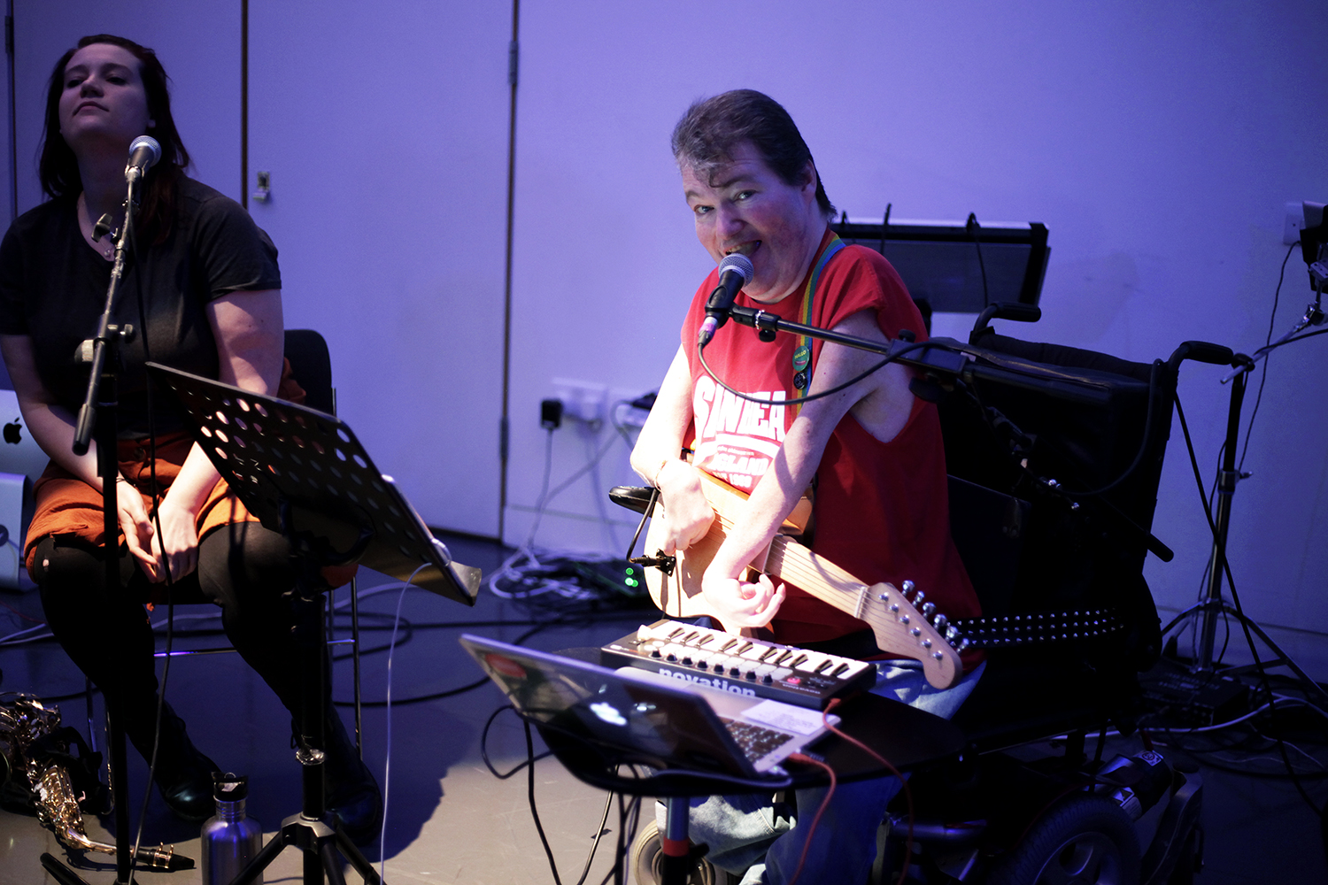 John Kelly playing some accessible musical instruments.